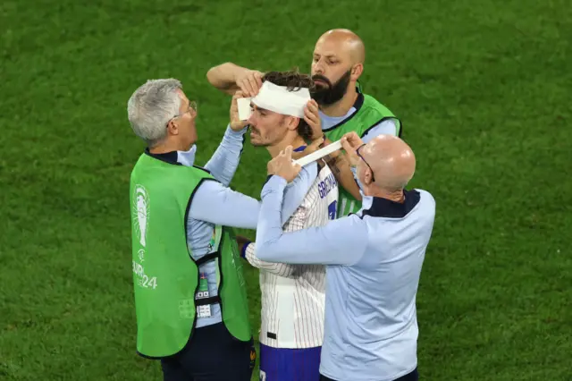 Antoine Griezmann with his head bandaged