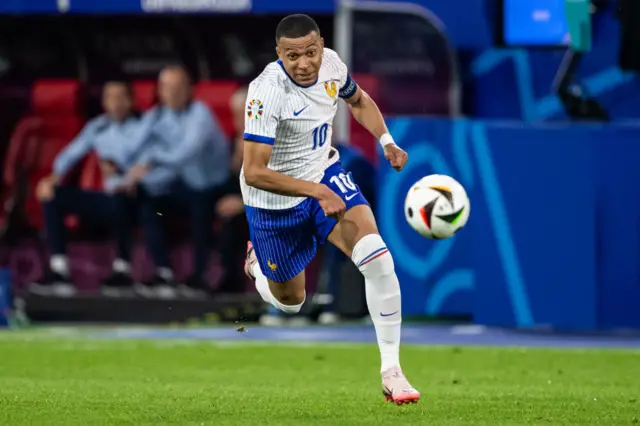 Kylian Mbappe running for the ball