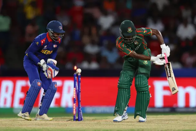 Jaker Ali Anik of Bangladesh is bowled by Sandeep Lamichhane of Nepal (not pictured) during the ICC Men's T20 Cricket World Cup West Indies & USA 2024 match