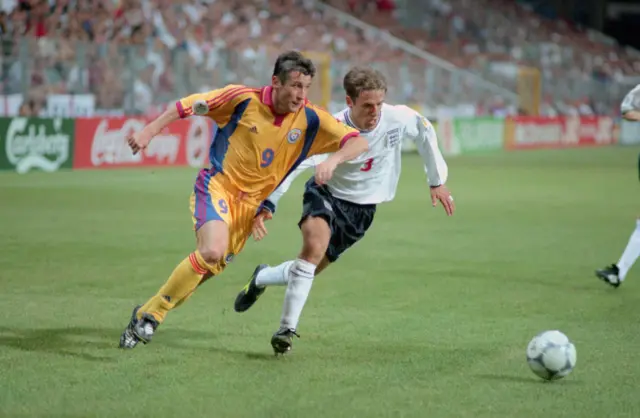 Phil Neville and Viorel Moldovan playing at Euro 2000