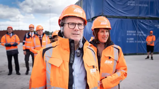 Labour leader Keir Starmer and shadow chancellor Rachel Reeves wearing high vis while vising the docks in Southampton