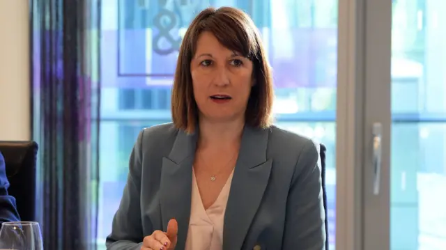 Shadow chancellor Rachel Reeves in a grey suit jacket speaking during a meeting with business leaders