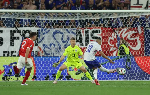 Kylian Mbappe shooting at the Austria goal