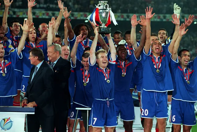 Didier Deschamps of France lifts the trophy with Zinedine Zidane and Marcel Desailly of France after winning the UEFA Euro 2000 Final