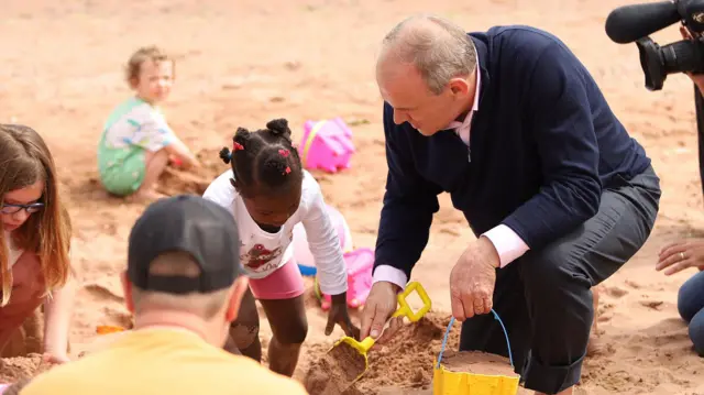 Liberal Democrats leader Sir Ed Davey builds sandcastles with children at Broadsands Beach, Paignton, Devon, while on the General Election campaign trail. Picture date: Monday June 17, 2024.