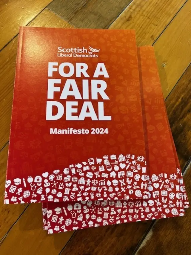 Red book reading 'Scottish Liberal Democrats: For a fair deal manifesto 2024