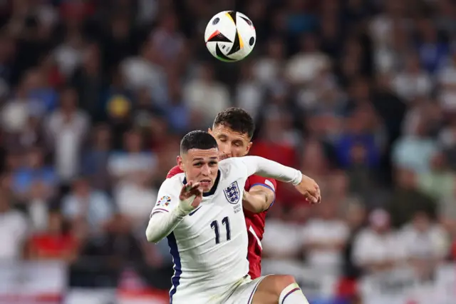 Foden vies for the ball
