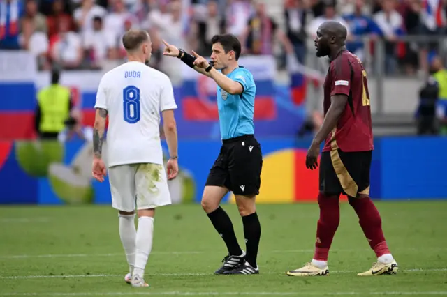 Referee Umut Meler gestures as he disallows the goal scored by Romelu Lukaku of Belgium