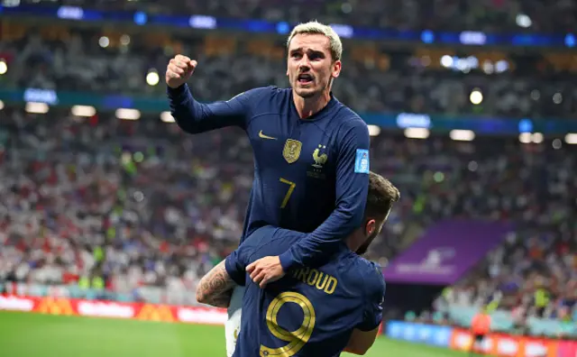 Olivier Giroud of France celebrates after he scores a goal with Antoine Griezman