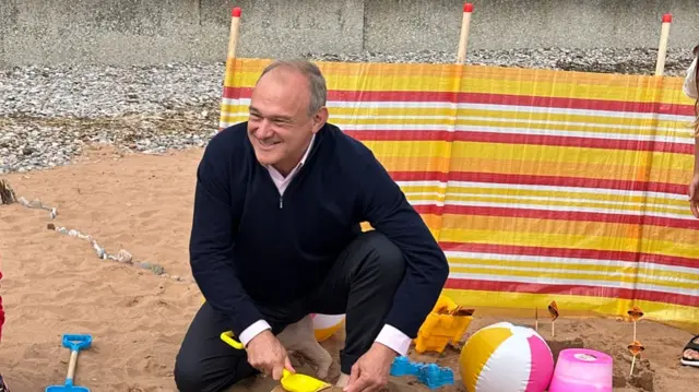 Davey pictured building a sandcastle near Paignton