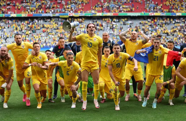 Romania players celebrate