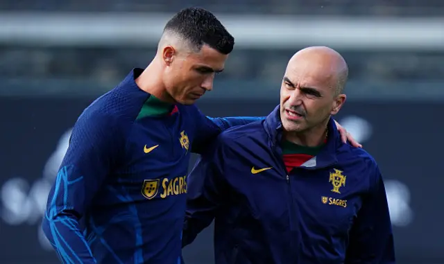 Roberto Martinez of Portugal speaks with Cristiano Ronaldo