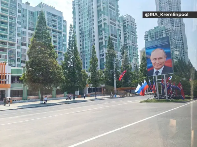 Portraits of Vladimir Putin and Russian flags line the streets of Pyongyang