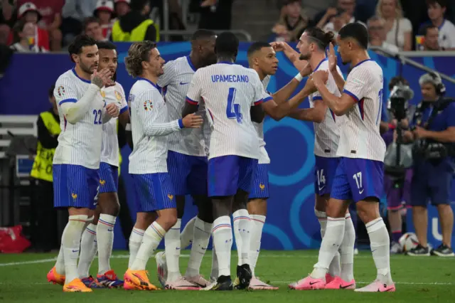 France's players celebrate after scoring against Austria