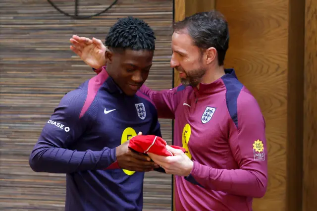 Gareth Southgate hands Kobbie Mainoo his England cap