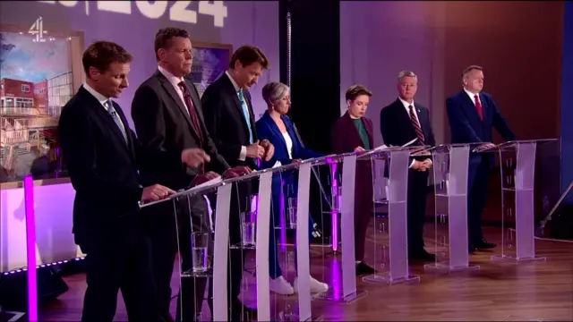 Representatives stand at lecterns