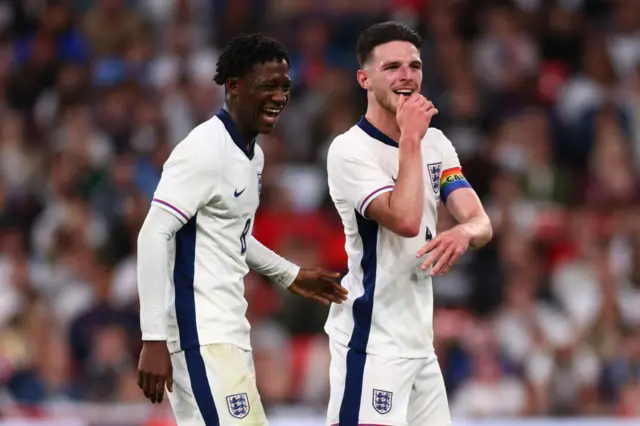 Kobbie Mainoo laughs with Declan Rice