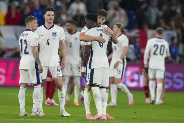 England players celebrate after beating Serbia