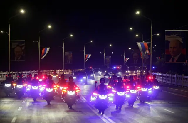 A motorcade of Russia's President Vladimir Putin and North Korea's leader Kim Jong Un moves along a road in Pyongyang, North Korea June 19, 2024