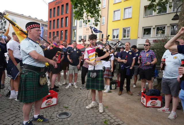 Scottish fans playing the bagpipes