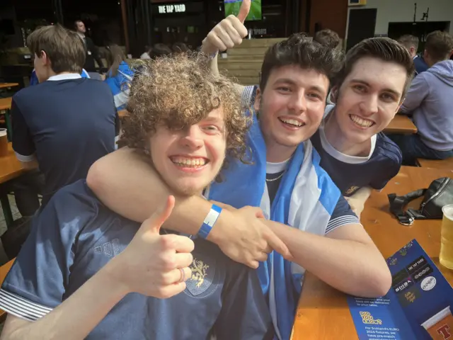 Thomas Tait (middle) with pals at the fan zone in Glasgow's Merchant Square.