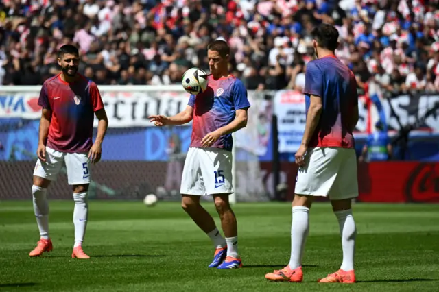 Croatia players do a passing drill in the warm up