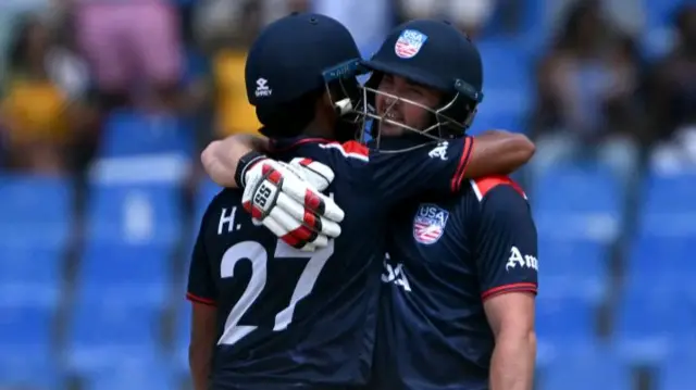 USA's Andries Gous (R) celebrates his half century with teammate Harmeet Singh during the ICC men's Twenty20 World Cup 2024 Super Eight cricket match between the United States and South Africa