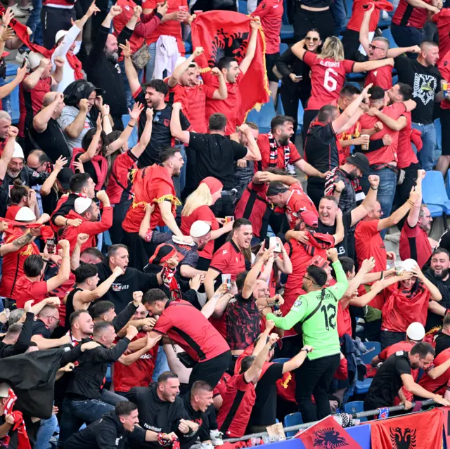 Albania fans celebrate wildly after their opening goal v Croatia