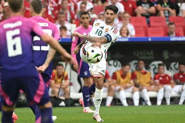 Dominik Szoboszlai kicks the ball