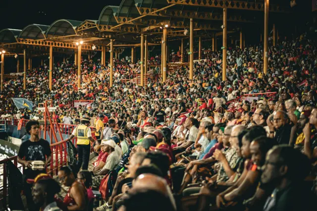 Fans watching a cricket game