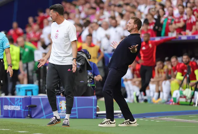 Coach Sandro Wagner and head Coach Julian Nagelsmann gestures