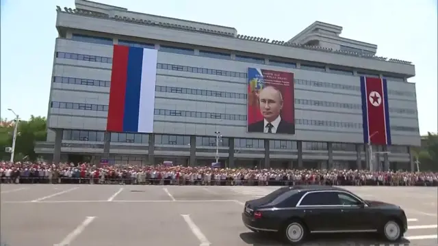 Some held flowers and waved flags