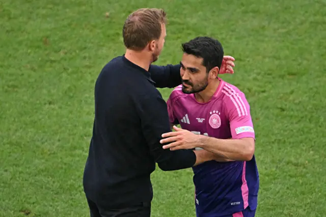 Germany's head coach Julian Nagelsmann greets Germany's midfielder #21 Ilkay Gundogan as he comes off