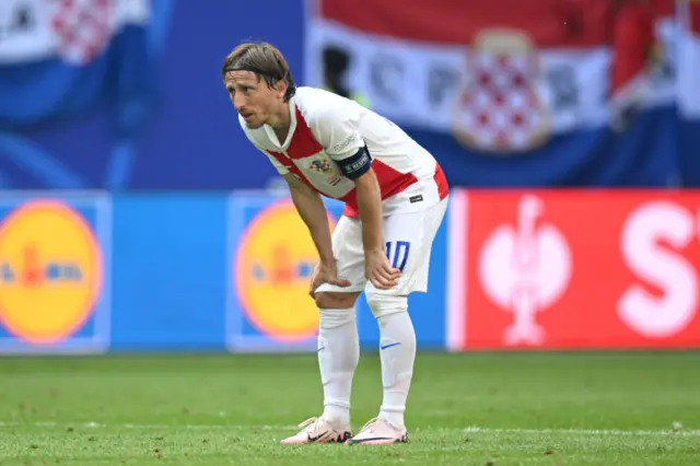 Modric stands on his haunches after a run