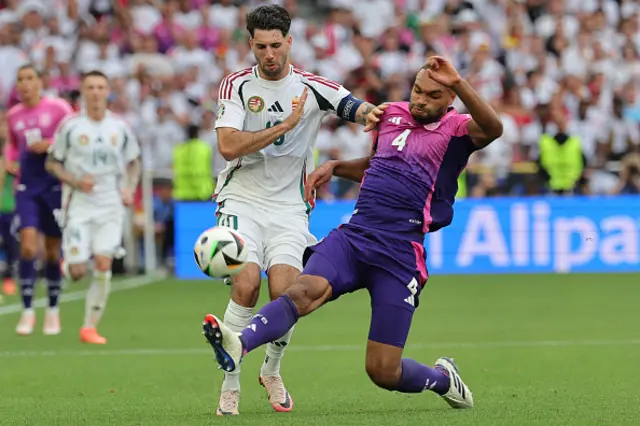 Jonathan Tah fights for the ball with Hungary's midfielder #10 Dominik Szoboszlai