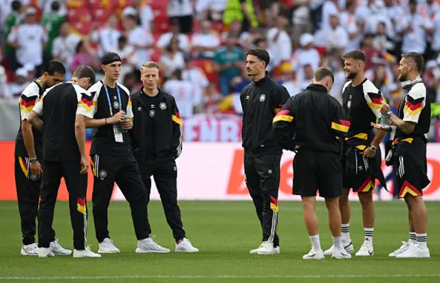 Nico Schlotterbeck, Chris Jan Fuehrich and Robin Koch of Germany inspect the pitch