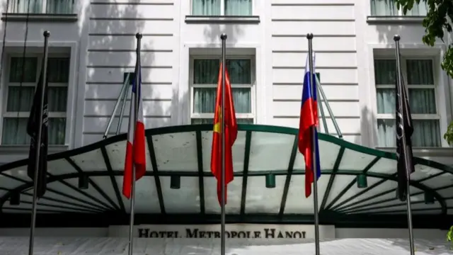 Vietnamese and Russian national flags outside Hotel Metropole Hanoi