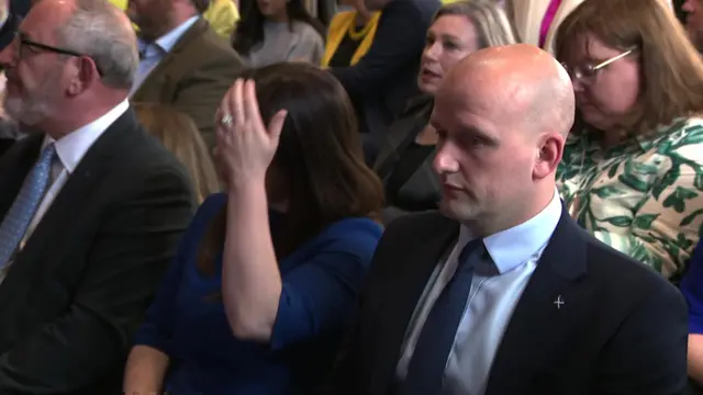 Stephen Flynn, Westminster leader for the SNP, sits in a chair at SNP manifesto launch