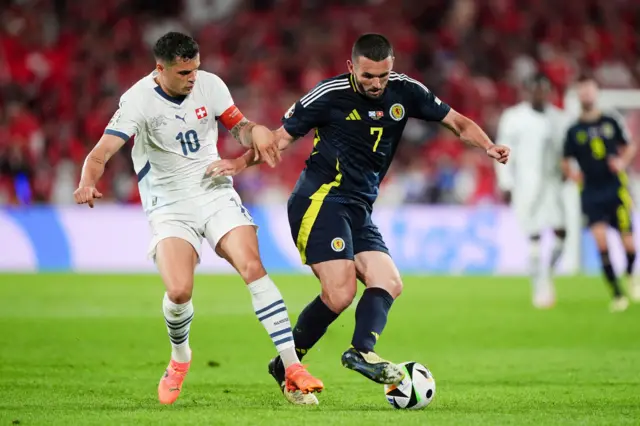 Switzerland's Granit Xhaka and Scotland's John McGinn