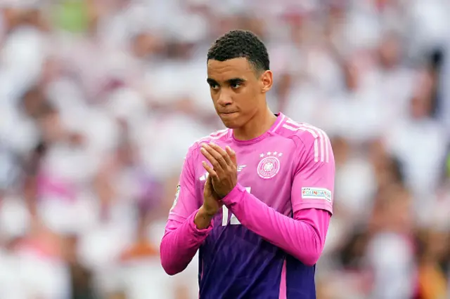 Jamal Musiala of Germany applauds the fans