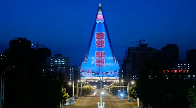 "Welcome Putin", read the words on Ryugyong Hotel