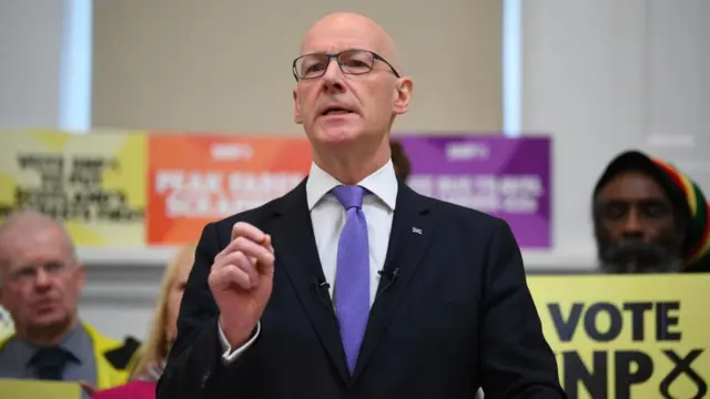 First Minister John Swinney delivers a speech in Glasgow