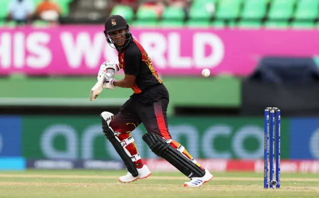 Papua New Guinea's Charles Amini plays a shot against West Indies