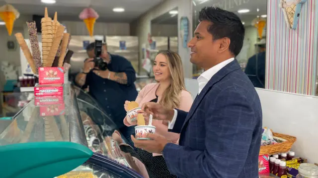 Scottish Conservative Deputy Leader Meghan Gallacher and Shadow Health Secretary Sandesh Gulhane inside an ice cream shop in Glasgow