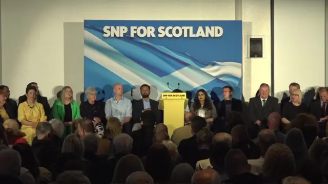 SNP campaign launch - MPs and SNP members sit on the stage