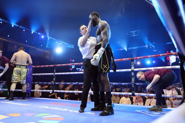 Referee helps Deontay Wilder in the ring