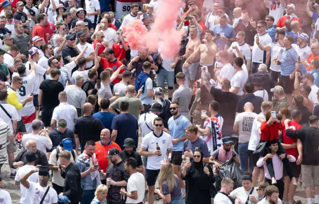 England fans light flares in the centre of Frankfurt