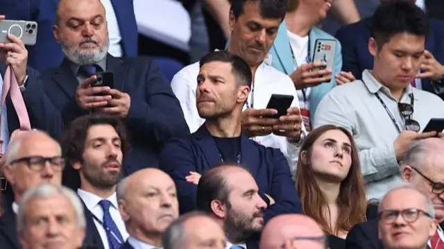 Xabi Alonso looks on from the stands