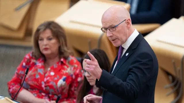 John Swinney speaks in the Scottish Parliament