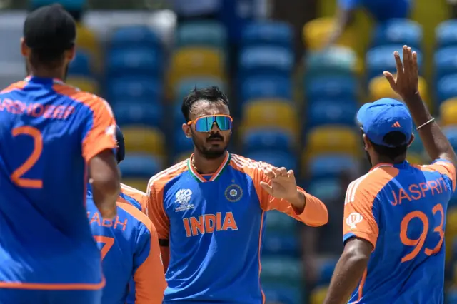 India's Axar Patel (C) celebrates the dismissal of Afghanistan's Ibrahim Zadran during the ICC men's Twenty20 World Cup 2024 Super Eight cricket match between Afghanistan and India at Kensington Oval in Bridgetown, Barbados